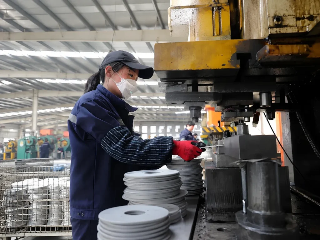 Brake workers are manufacturing brake discs. Brake workers are manufacturing brake discs.